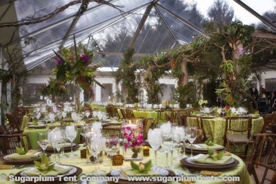 Beautiful floral arrangements beneath a clear tent