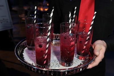 The black-and-white color scheme carried over into decor elements such as festive cocktail straws. The evening's signature drink was called 'the Diviner,' named after a novel by Margaret Laurence.