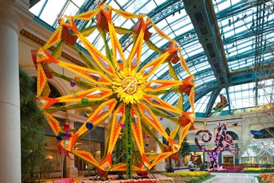 The spring 2011 installation at the Bellagio’s Conservatory & Botanical Gardens brought bright blooms and a playful carnival. Four gardens were filled with scents of tulips, hydrangeas, and daisies, and the look included a colorful Ferris wheel, moving carousel, and greenhouse full of butterflies. The moving 11-foot-tall carousel weighed more than 8,600 pounds, and was adorned with 330 clear bulbs and colorful acrylic balloons with a cedar ticket booth. The 40-foot full-scale Ferris wheel was decorated with animated lighting, and a stone-based rustic greenhouse housed more than 500 live butterflies from around the world.