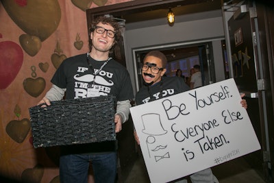 As guests arrived, the 'Little Brothers' and 'Big Brothers' handed out prop glasses and mustaches.