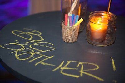 Kid-friendly decor included highboys with chalkboard surfaces. Jars of colored chalk let guests—both young and old—doodle as they sampled appetizers and drinks.