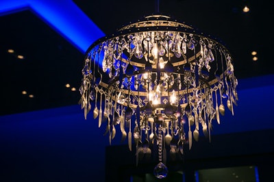 In the cocktail space, a chandelier made of silver utensils underscored the event's theme.