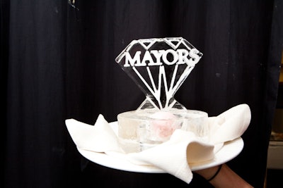 Although the decor for the 100th anniversary of Mayors in 2010 focused on individual brands like Breitling, Damiani, Montblanc, Tag Heuer, and Rolex, one food item was more specific. Chef Michael Finizia of the Ritz-Carlton in Coconut Grove created the menu, which included an intermezzo of white peach gelato in an ice sculpture carved with the Mayors logo.