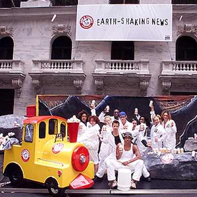 The Axis team of dances posed with an Arm & Hammer train in front of the New York Stock Exchange.