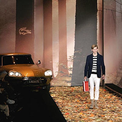 A printed backdrop and a gold-colored Citroën sat at the entrance of the Lacoste runway.
