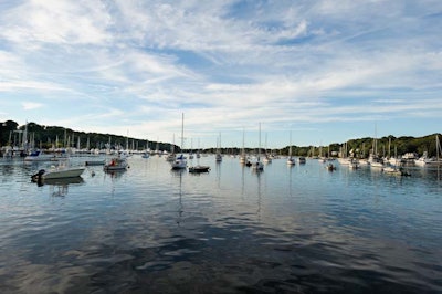 Harbor Club at Prime offers a vantage point for stunning sunset views offset by Gold Coast mansions and luxury yachts.