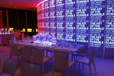 Word art displayed in various forms throughout the gala conveyed an abstract event theme. The lighting on a curved wall changed colors every few seconds to offer even more visual interest.