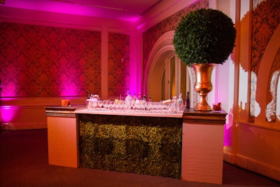 A bar front covered with moss added a tactile, playful element to the elegant decor.