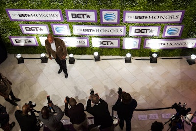 Guests at the BET Honors dinner posed for photographs in front of a step-and-repeat inspired by boxwood hedges.