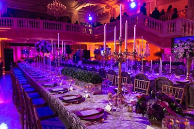 Purple lighting, gold details, and tablecloths in rich eggplant and lavender matched the dinner's elegant setting in the National Museum of Women in the Arts.