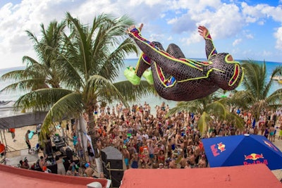 Performer Crazy Purdy does acrobatics in Playa Mia.