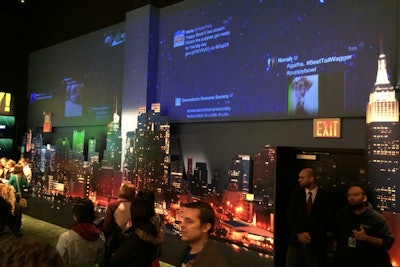 Animal Planet also incorporated the New York City skyline into its activation, the Puppy Bowl Experience at Discovery Times Square Exposition. Projections above the images of Manhattan blended a starry night sky with tweets from guests.