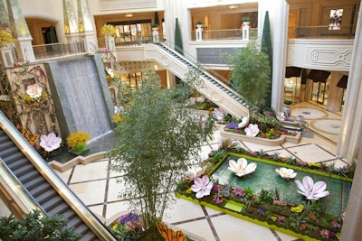 For spring 2012, a combination of 6- and 10-foot hand-painted canvas magnolias and butterflies decked the Palazzo Waterfall Atrium. Thousands of stems of forsythia were used on the waterfall and gardens, and thousands of hyacinth plants in purple, pink, and white filled the entire atrium garden with fragrance.