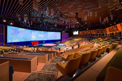 The conference's iconic short talks took place in a 1,200-seat theater that was constructed from thousands of laser-cut pieces. The goal of the temporary, David Rockwell-designed space was to make the convention center space feel more exclusive and on-brand. The theater was designed to be dismantled and stored until the next incarnation of the event.