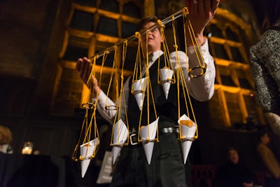 The contraption that held paper cones of truffle tater tots was a nod to trapeze acts.