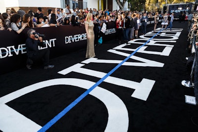 The arrivals carpet, which was black with an inset of the movie's logo, saw actors like Shailene Woodley, Theo James, and Kate Winslet pose for photos before the premiere screening. Later, a swarm of fans gathered in the same space for a live performance.