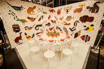 At the Designtex table, a white floor and simple three-legged stools kept the focus on the 12 wall coverings and textiles developed with Todd Oldham. The design complemented Charley Harper’s large illustrations.