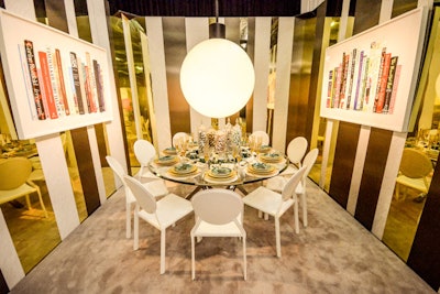 Nothing says 1970s penthouse dining room like touches of gold, malachite, and marble—and the Essie vignette designed by Robert Verdi was chock-full of glamour and party atmosphere. Adding to the look was an oversize orb chandelier that reflected the metallic walls.