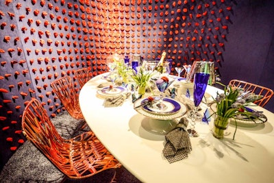 In collaboration with HOK, Knoll covered its vignette in blues and reds, a look that sought to reflect the brand identities of Knoll and the newly merged HOK and BBG-BBGM. A curved back wall was dotted with morphing rose buds, which were fully bloomed in the center.