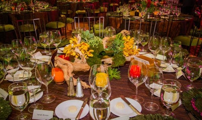 Tables incorporating minimal florals and elements that can be repurposed are a sustainable design staple. The hand-blown glass votives are by GlassyBaby who donate proceeds to charity.