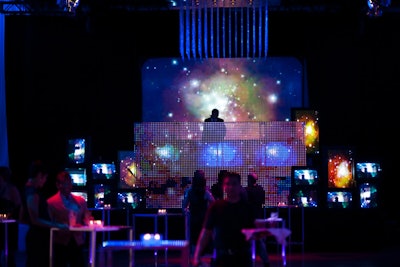 The opening gala for the Toronto International Film Festival in 2011, held at the Liberty Grand, took its space-age theme from the festival's opening film, From the Sky Down, a documentary about U2. Band members Bono and the Edge were among the attendees at the event, where audiovisual and lighting components served as decor focal points, thanks to a collaborative effort from Westbury National Show Systems and ESG Show Services. On TV screens, a looped video depicted surreal images of things like a mirror ball, the galaxy, and static.
