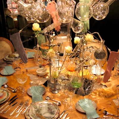 At the Design Industries Foundation Fighting AIDS' Dining by Design benefit, Quest International Fragrances created an innovative centerpiece of Bunsen burners, beakers, test tubes, white roses, and pastel-colored elbow gloves. The mix-and-match tableware included plates from East Village shop John Derian, with vintage drawings of plants on top of ornate, floral-patterned china.
