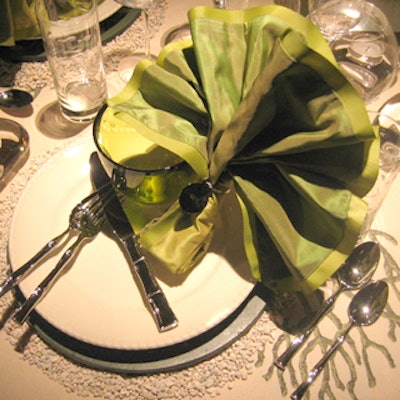 Michael Tavano's table for fabric company Schumacher featured utensils with bamboo-shaped handles placed in an X shape atop the plates. His reason: It gets people into the mindset to start eating.