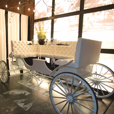 The Savannah College of Art and Design's senior vice president of college resources, Glenn Wallace, designed a white carriage—emblematic of Savannah—modified as a dining banquette. Parked on chalkboard tiles embellished with drawings of the city by SCAD students, the carriage sat in front of an illuminated wall that depicted Savannah's Forsyth Park.