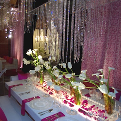 David Beahm's two tables at the event's entrance had white tulips and calla lilies swooping up toward strands of crystals hanging from the ceiling—a design meant to suggest the people lost to AIDS ascending to heaven, he said, and to acknowledge Diffa's work funding AIDS organizations.