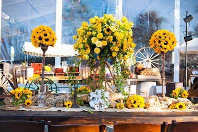Arrangements of sunflowers set a sunny tone throughout the party space.