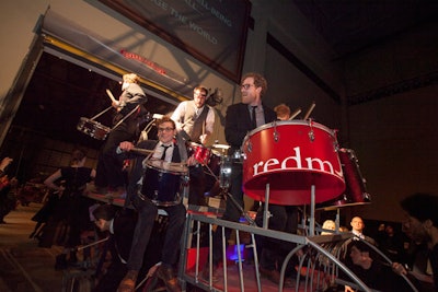 The evening included an award presentation. Howard Tullman was recognized as the '2014 Community Galvanizer,' and the presentation of his award was accompanied by a personalized drum performance.