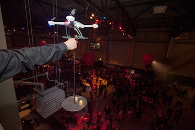 For another 'give and get' experience, a trained remote-control pilot from Horizon Hobby loaded a 'pastry drone' with a tray of sweets from the French Pasty School and West Town Bakery. He launched the drone from the second floor of the Luna Lodge.