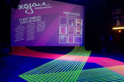 Event production agency MKG brightened up a dark room using neon masking tape and ultraviolet lighting, creating an edgy, Pop Art-inspired look for the party for online magazine xoJane.com. Upstairs, guests were encouraged to take selfies with mirrors; images were printed by the Bosco to add onto the Shameless Selfie wall and were projected in the main room.