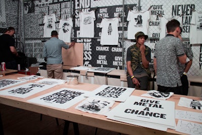 Taking a cue from presenting sponsor Converse, the Fader Fort was marked by a black-and-white color scheme, from the wheat-pasted slogan-filled posters covering the interior walls to sneakers that hung from the ceiling.