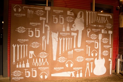 At the Dickies Roadhouse presented by Amazon, brand imagery was mixed with tool- and musical-instrument-shaped silhouettes on pegboards, which served as photo backdrops as well as themed space dividers.