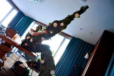 Entertainment included a 'flower woman' on stilts. The performer, World Gate Entertainment, posed with guests and handed out so-called 'flower fortunes.'