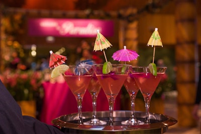 Pink 'Paradise' cocktails nodded to the rosy hue of the surrounding orchids. Guests sipped the drinks in resort-style lounge furniture donated by Williams Ski & Patio.