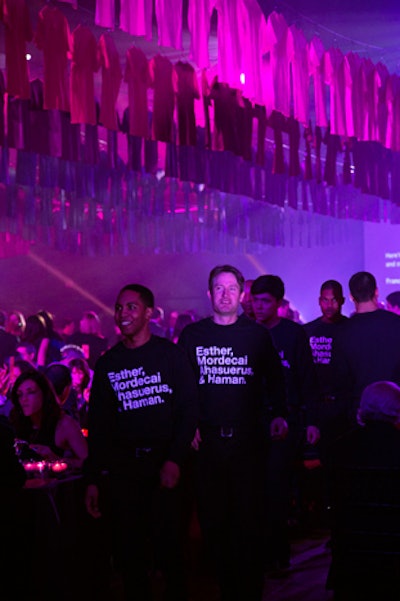 Staffers also matched the evening's design, sporting long-sleeved tees printed with 'Esther, Mordecai, Ahasuerus & Haman,' the names of the main characters in the story of Purim.