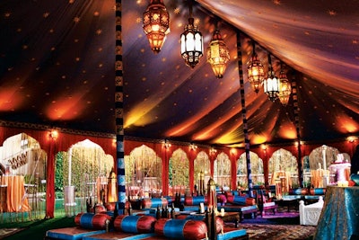 The Grand Marakesh from Raj Tents is a 27- by 44-foot Moroccan-theme tent that includes arches and silk string drops on all openings, a full lighting package, and furniture for 24 guests with low tables and area rugs. It has room for as many as 120 people and is available for rent throughout the United States for $9,950.
