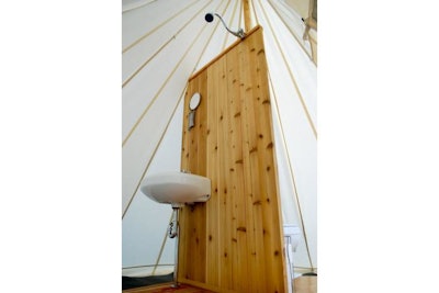 A bathroom in a teepee. What a novelty for guests.