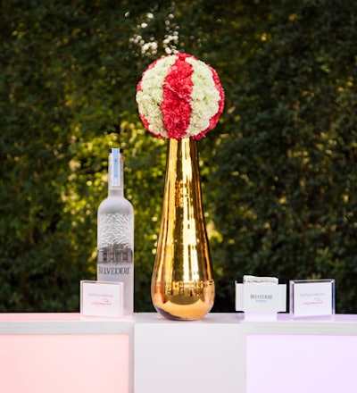 Florals at the event included a ball of carnations that evoked the classic image of a circus elephant standing on a ball.