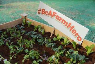 The event's hashtag appeared throughout, including in raised beds of lettuce, strawberries, and herbs.
