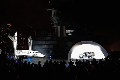 Land Rover design director Gerry McGovern introduced the car. Following his remarks, the stanchions were removed to afford guests an up-close look at both vehicles. Courtesy of Land Rover, SpaceShipTwo remained on display at the museum for the public to view from April 15 to 22.