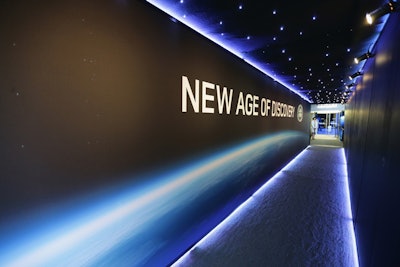 Following check-in, guests arrived onto the Intrepid via a long hallway decorated and lit to resemble outer space—fitting, given the evening's 'New Age of Discovery' theme. 'We wanted to add to the feeling of a future technology age,' said Ross Wheeler, head of the automotive team at Imagination, Land Rover's long-time event production firm.