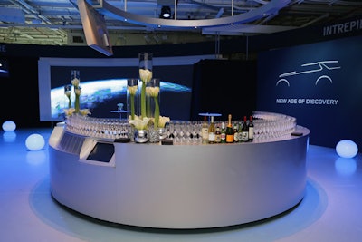 Given the overarching theme of discovery and outer space travel, a circular motif was chosen for much of the event's furniture. That included the circular bars as well as the glowing orbs that not only peppered the inside of the venue, but also the driveway leading to the Intrepid from the West Side Highway.