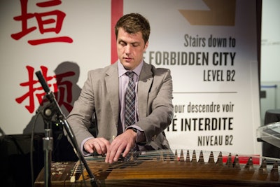 Musician David Sait gave a performance on a guzheng (a Chinese plucked instrument) near the entrance to the exhibition.