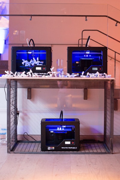 A 3-D printer created miniature replicas of the construction set, and bottle connectors.