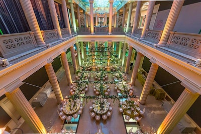 Yours Truly Lighting and Decor illuminated the main atrium on both levels with green and gold uplighting.