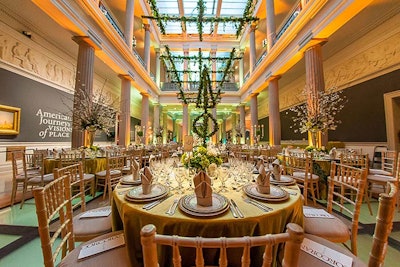 The main atrium had a garden atmosphere that continued to the second floor with an illuminated green floor and vine-covered trellising suspended above the tables.