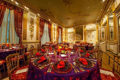 Taking a cue from the walls, the tables had gold chairs and flatware.